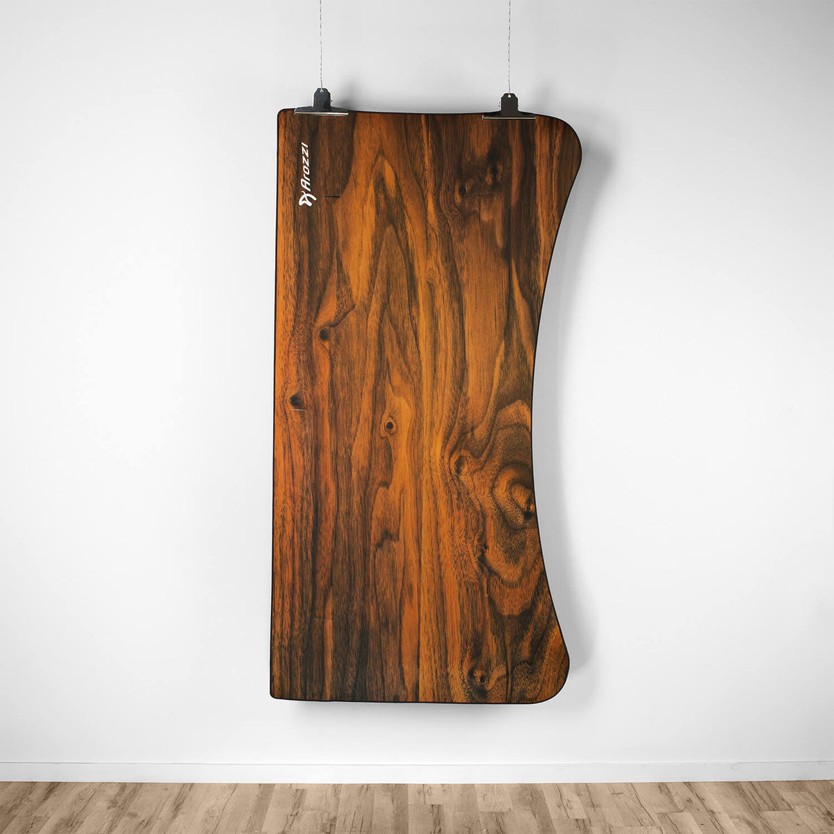 Curved wooden desk topped with the Arozzi Europe Arena Mousepad, perfect for display or work.