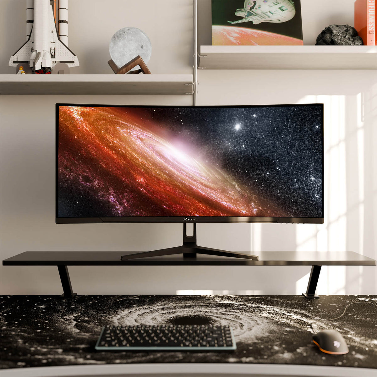 Arozzi Europe Arena Mousepad on desk with ultrawide monitor showing galaxy and space-themed decor.