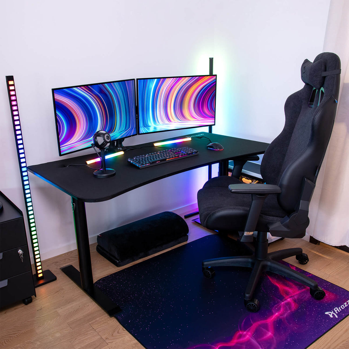 Arozzi Arena Gaming Desk-Medium with dual monitors, RGB, black chair, keyboard, mouse & mic.