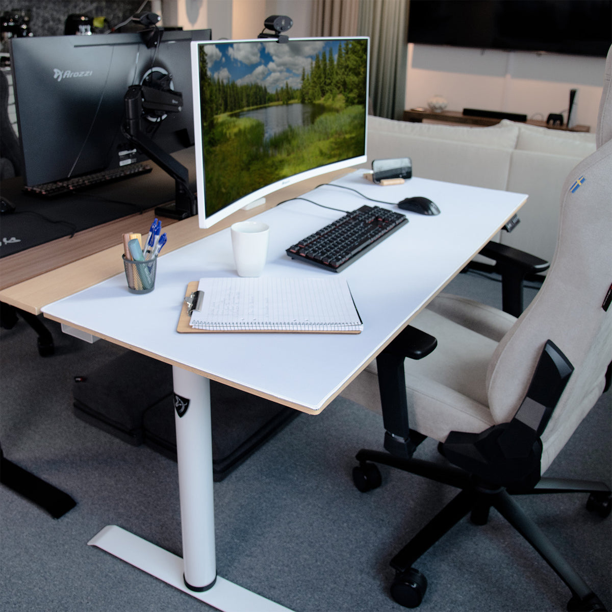 Modern desk with curved monitor, keyboard, chair, and Arozzi Europe Arena Nordico Mousepad.