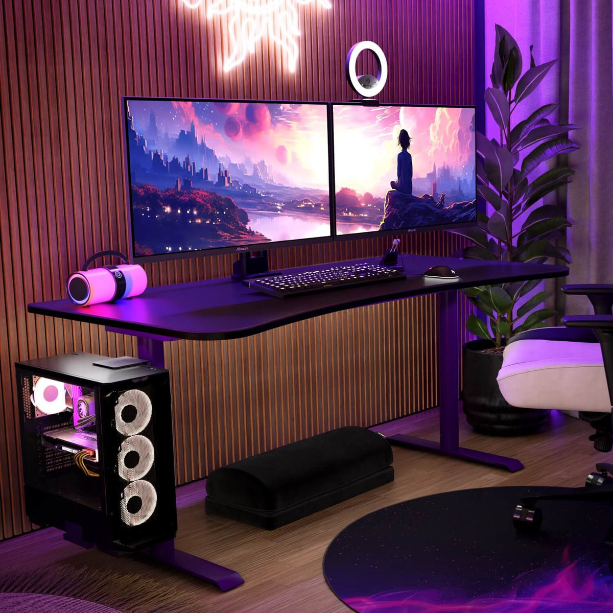 Two monitors on an Arozzi Arena Gaming Desk with RGB lights, tidy cables, and a sleek keyboard.