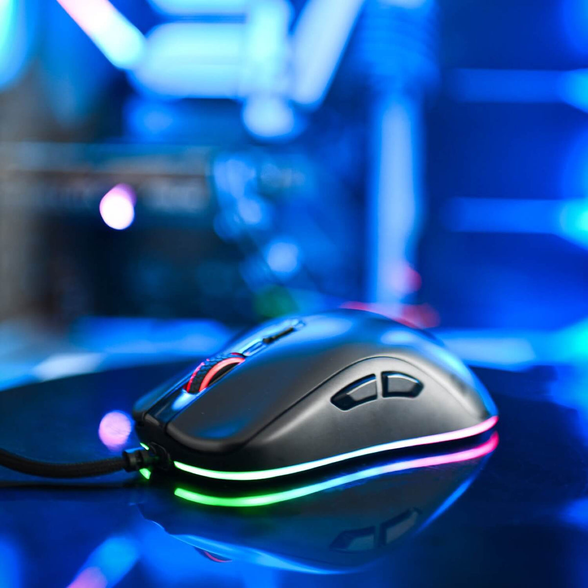 Arozzi Europe Favo 2 Ultra Light Gaming Mouse with customizable RGB on mouse pad, blue blur.