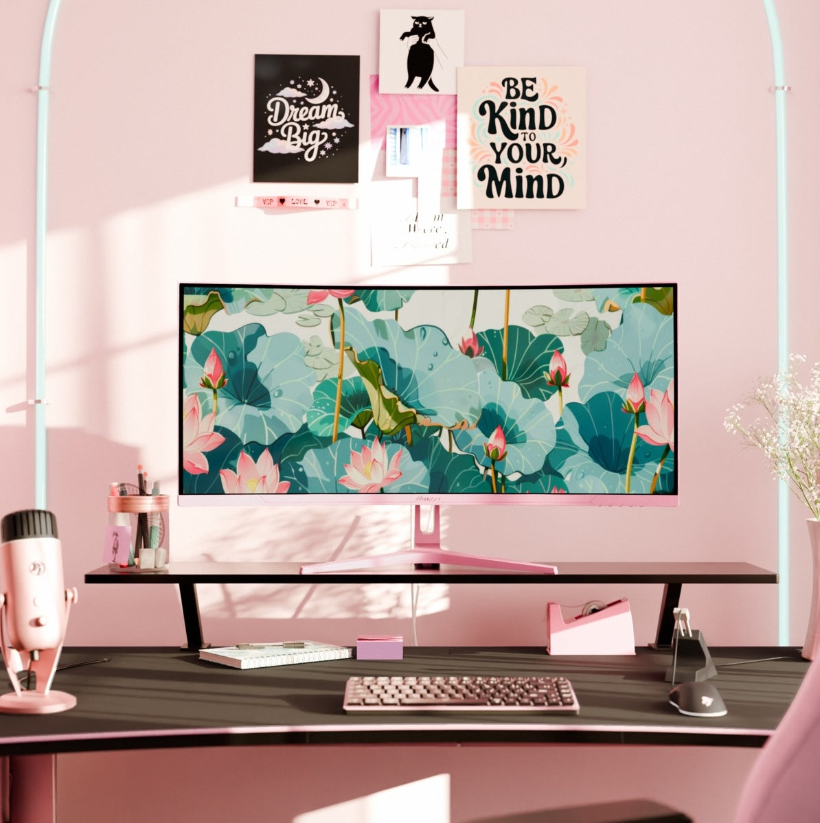 Pink desk setup with Arozzi Nova 34″ Curved VA 165Hz UWQHD monitor and lotus wallpaper.