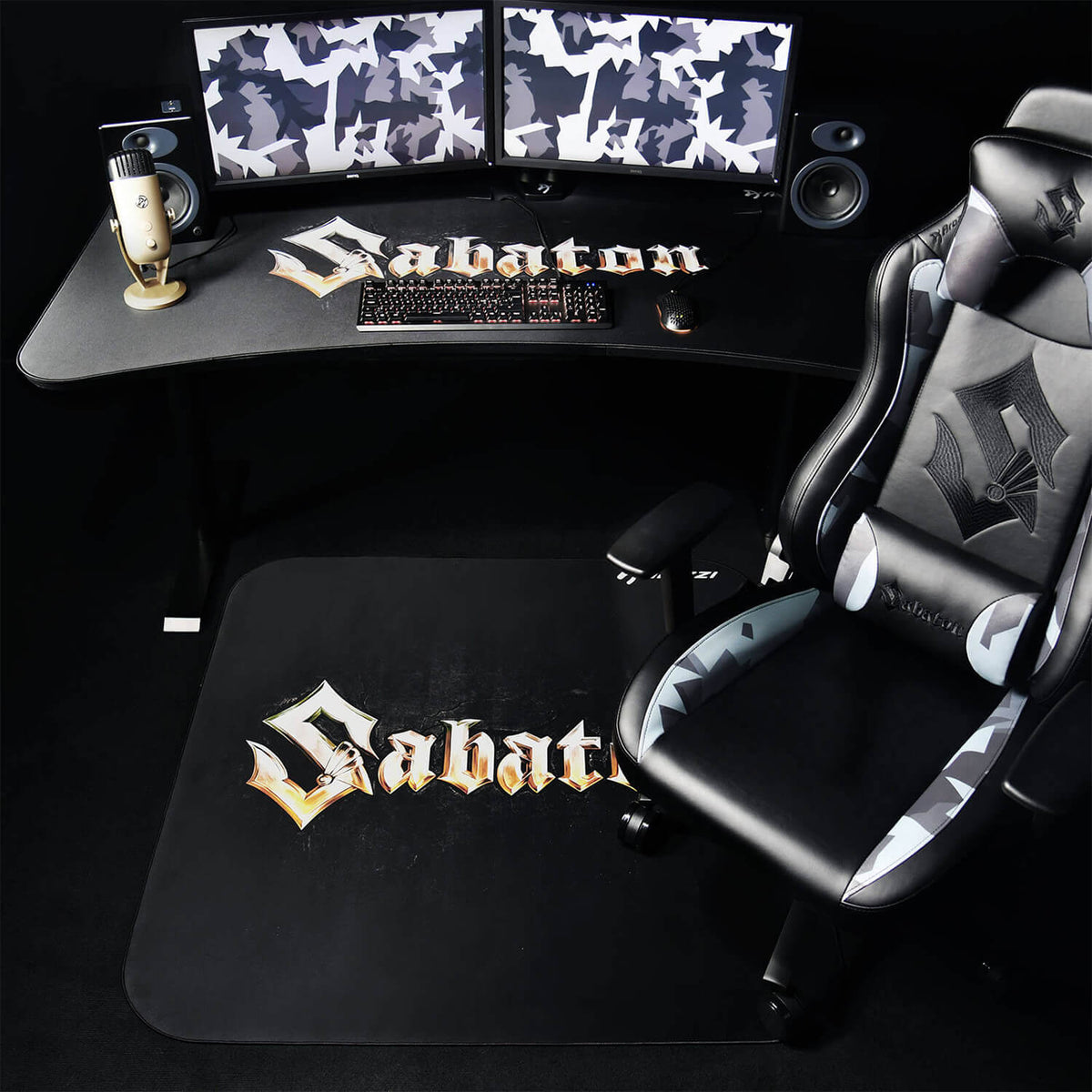 Black gaming setup with Sabaton logos and Arozzi Zona Square Floor Pad - Sabaton Edition.