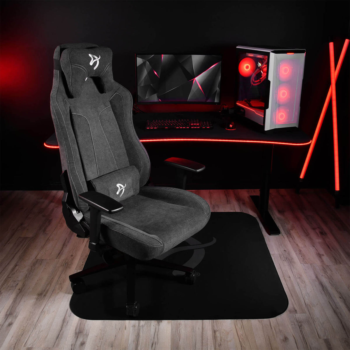 Arozzi Europe Zona Square Floor Pad under black gaming chair in red-lit PC setup on wood floor.
