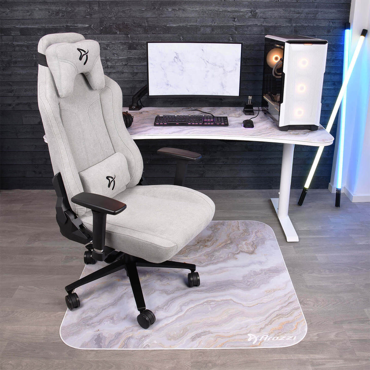 Modern gaming office with gray chair, desk, PC, monitor & Arozzi Zona Square Floor Pad.