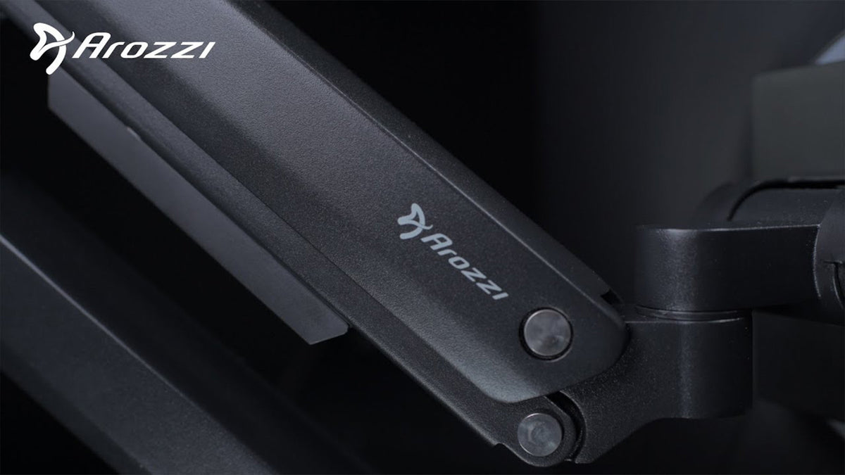 Close-up of a black Arozzi armrest with the Arozzi logo and text visible.