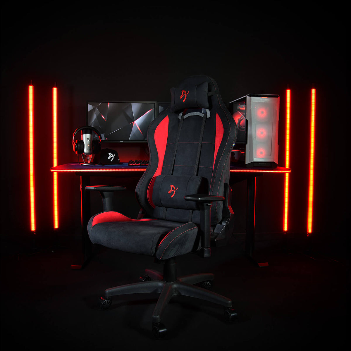 Arozzi Europe Torretta Supersoft chair with support pillows at desk with PC, red LED lights.