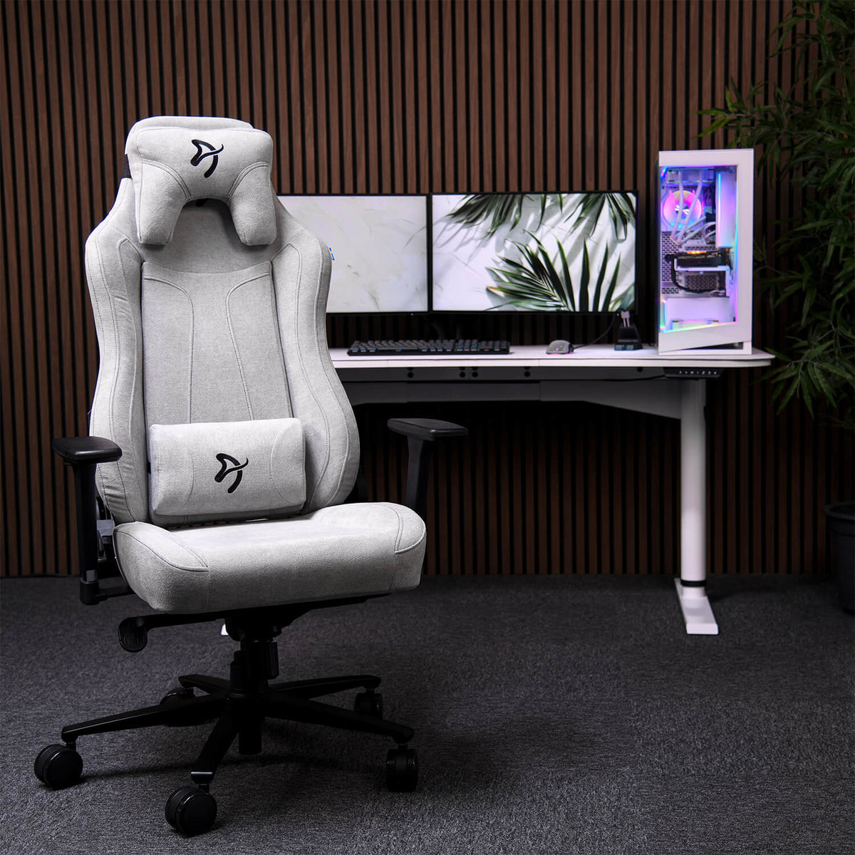 Arozzi Europe Vernazza Soft Fabric gray chair with adjustable height at a modern dual-monitor desk.
