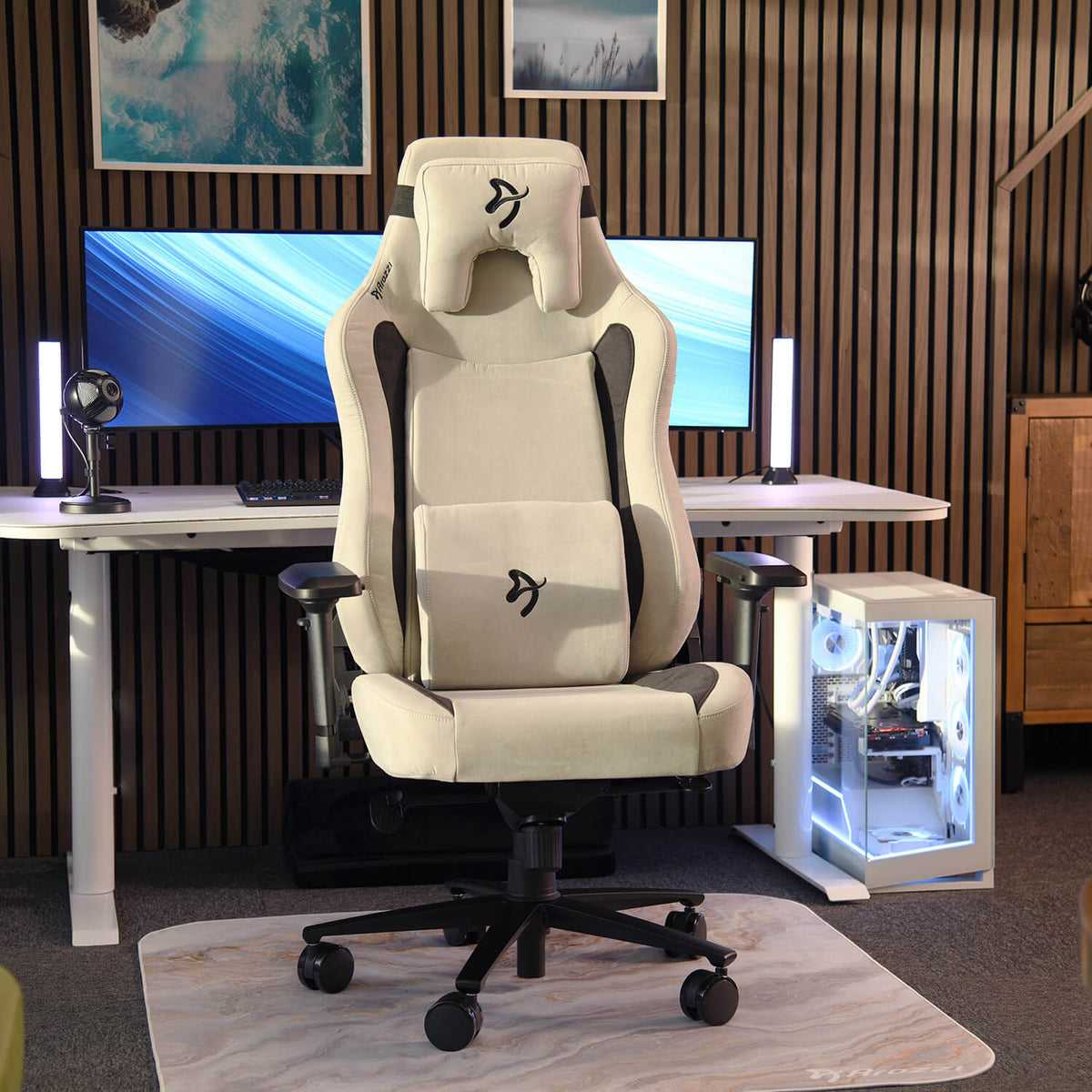 Arozzi Europe Vernazza XL Supersoft gaming chair in front of a desk with monitors and PC case.