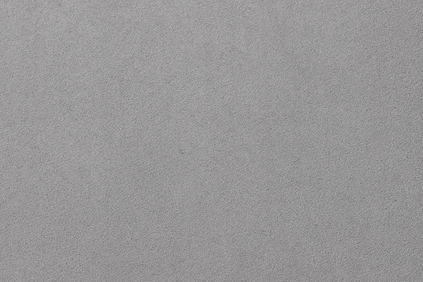 Gray textured surface, possibly concrete or stone, with a slightly rough appearance.