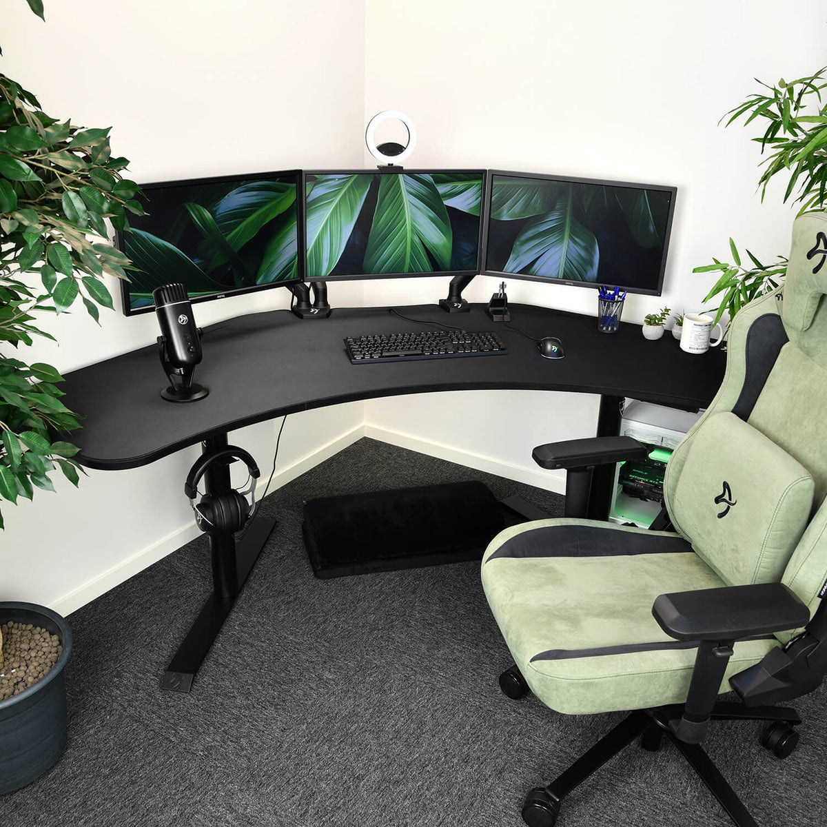 Arena Angelo by Arozzi Europe: ergonomic corner desk, triple monitors, mic, keyboard, gaming chair.