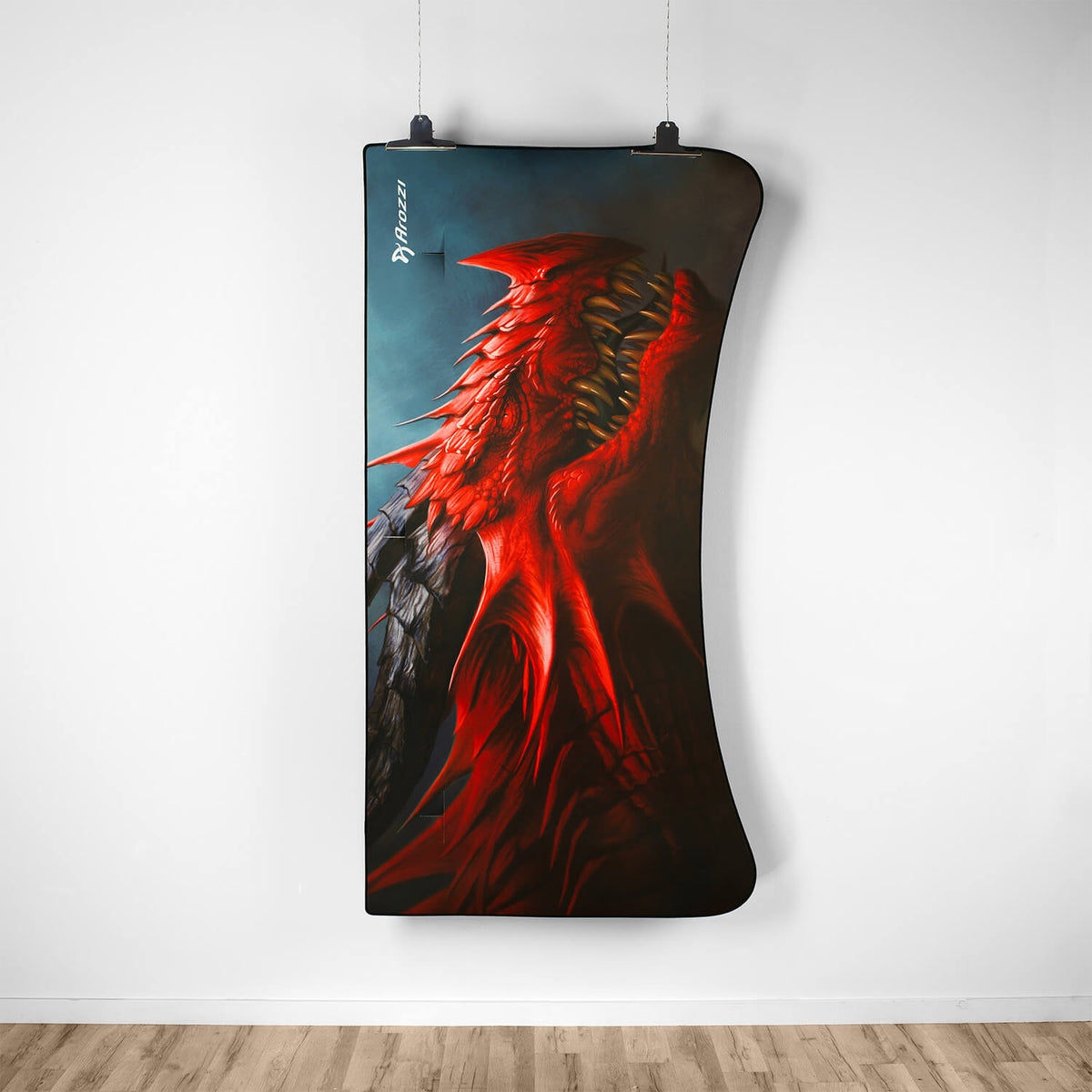 Arena Mousepad by Arozzi Europe featuring a bold red dragon wing, displayed on a white wall.