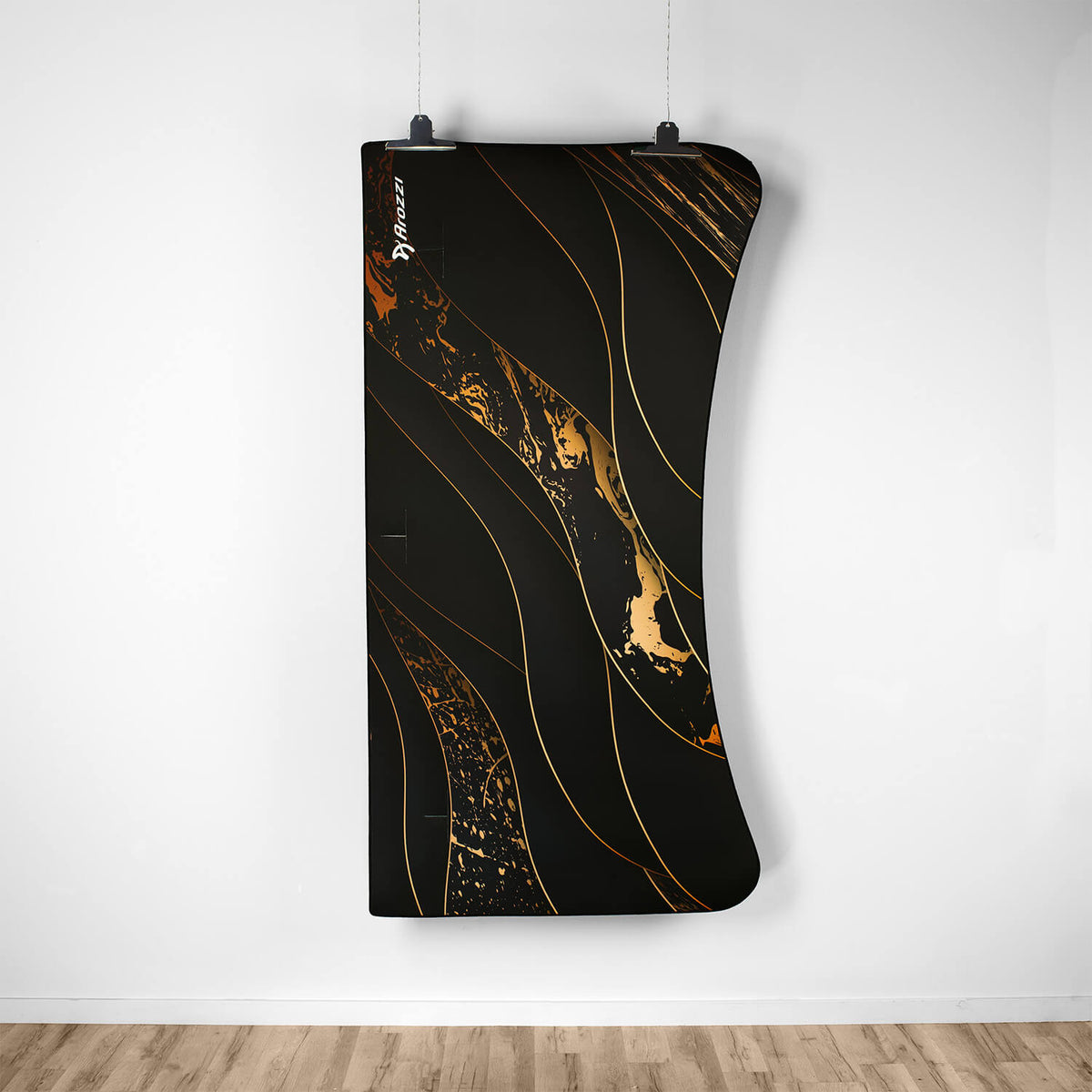 Arozzi Europe Arena Mousepad with gold swirls curves above a wood floor like a custom desk.