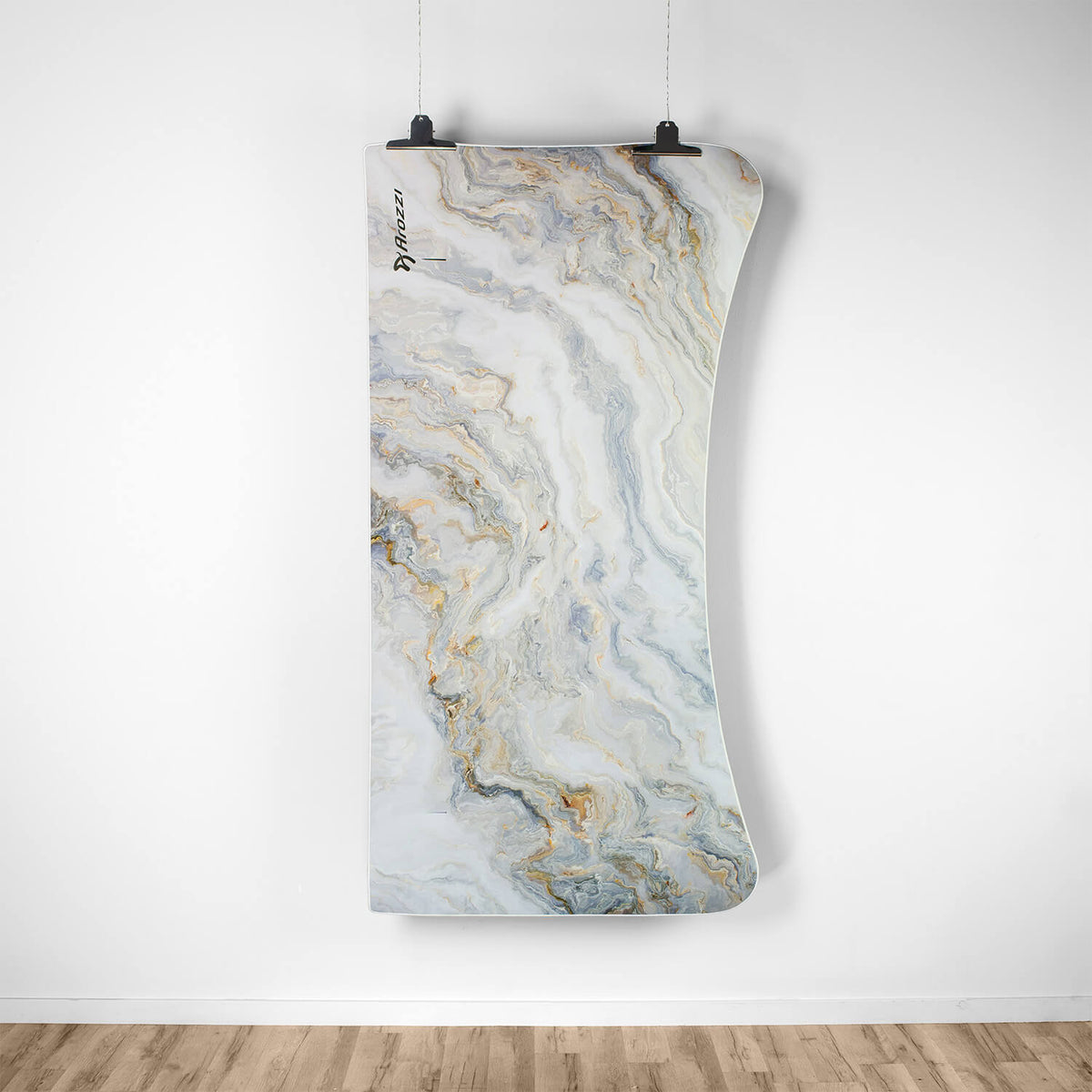 Curved marble yoga mat above hardwood floor, next to Arozzi Europe Arena Mousepad.