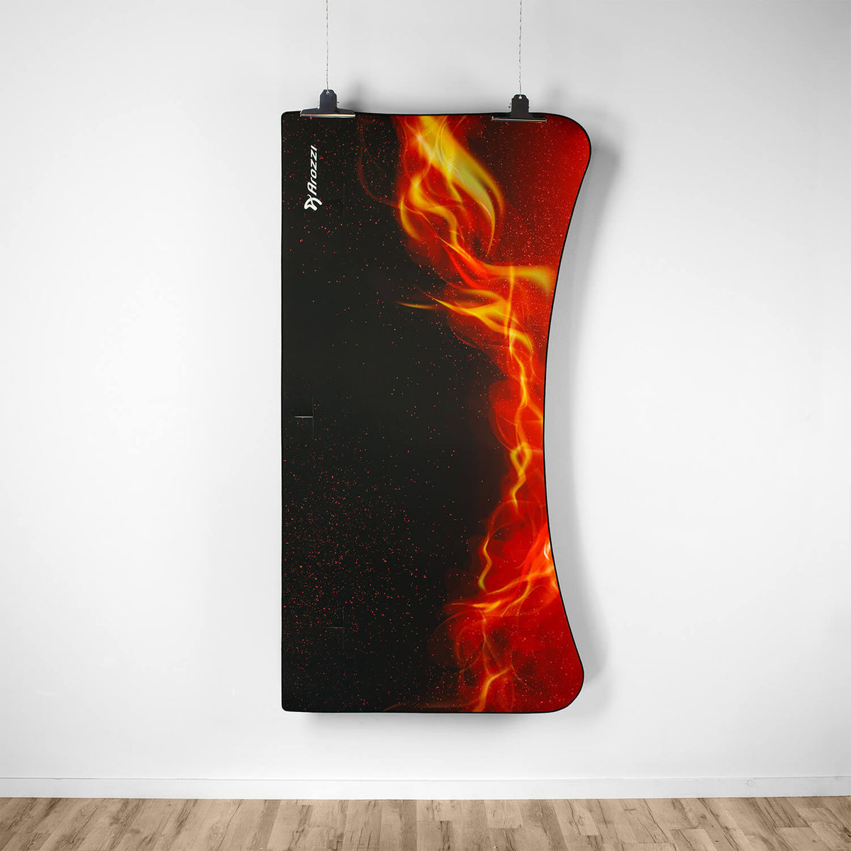 Curved black Arena Mousepad by Arozzi Europe with red-yellow flames displayed on a white wall.