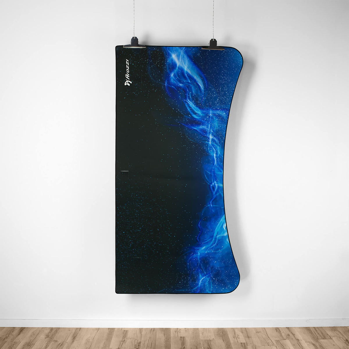 Arozzi Europe Arena Mousepad, curved rectangle with blue abstract design, above wooden floor.