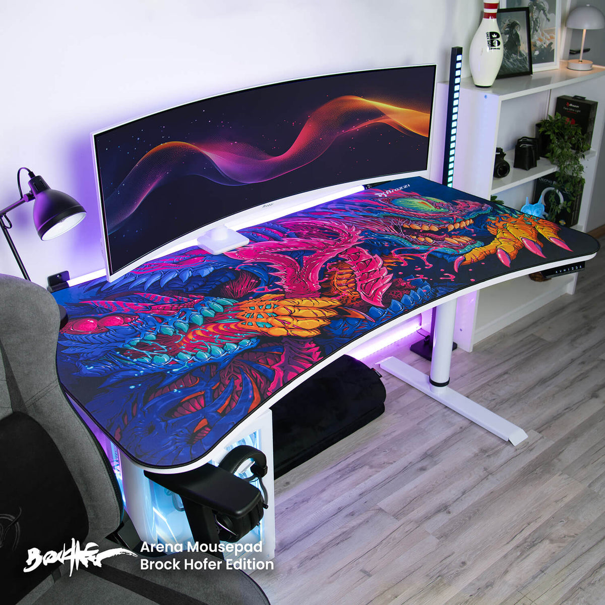 Colorful setup with Arena Mousepad by Arozzi Europe and a curved monitor on a white desk.