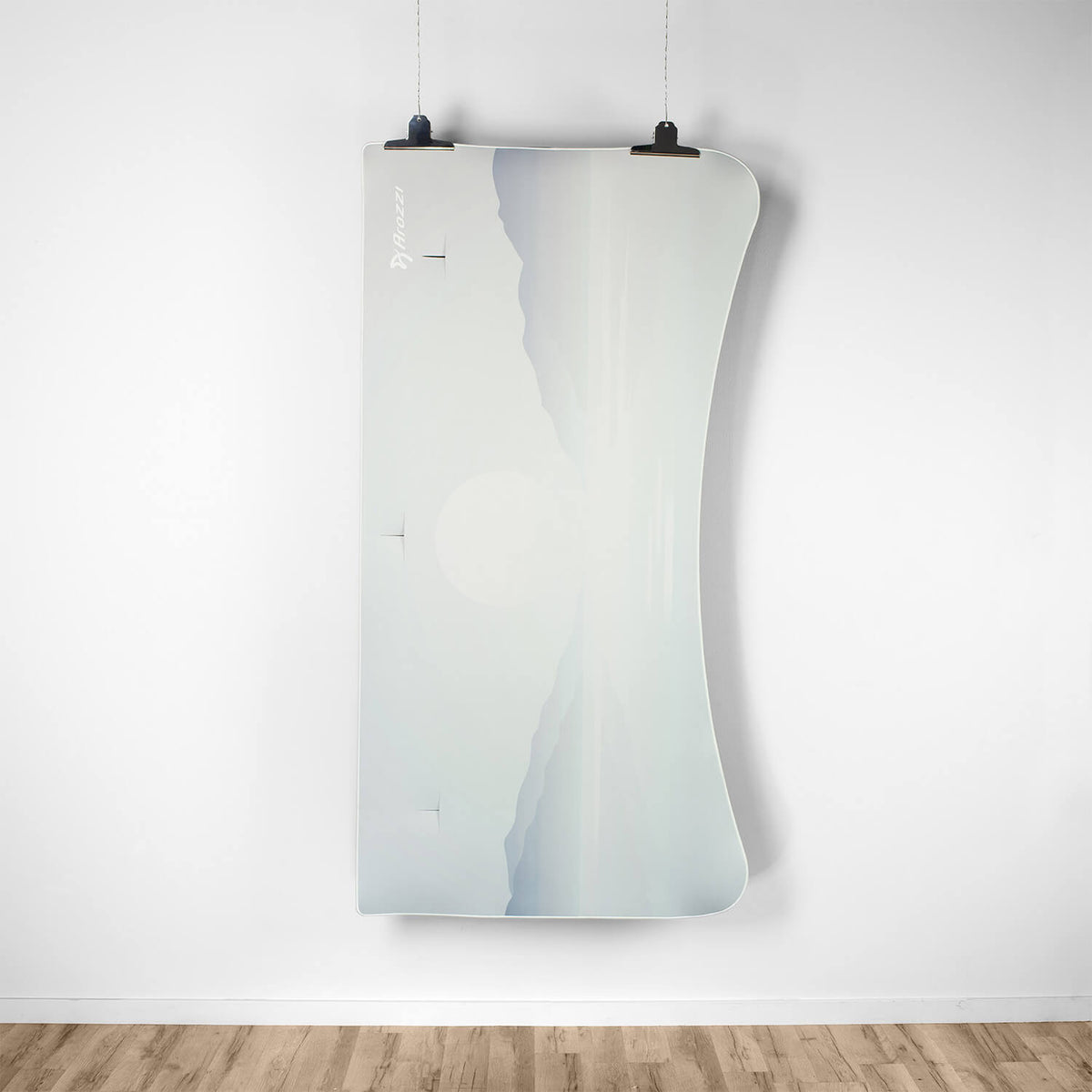 Curved mirror with a mountain-sun design, next to the Arozzi Europe Arena Mousepad.