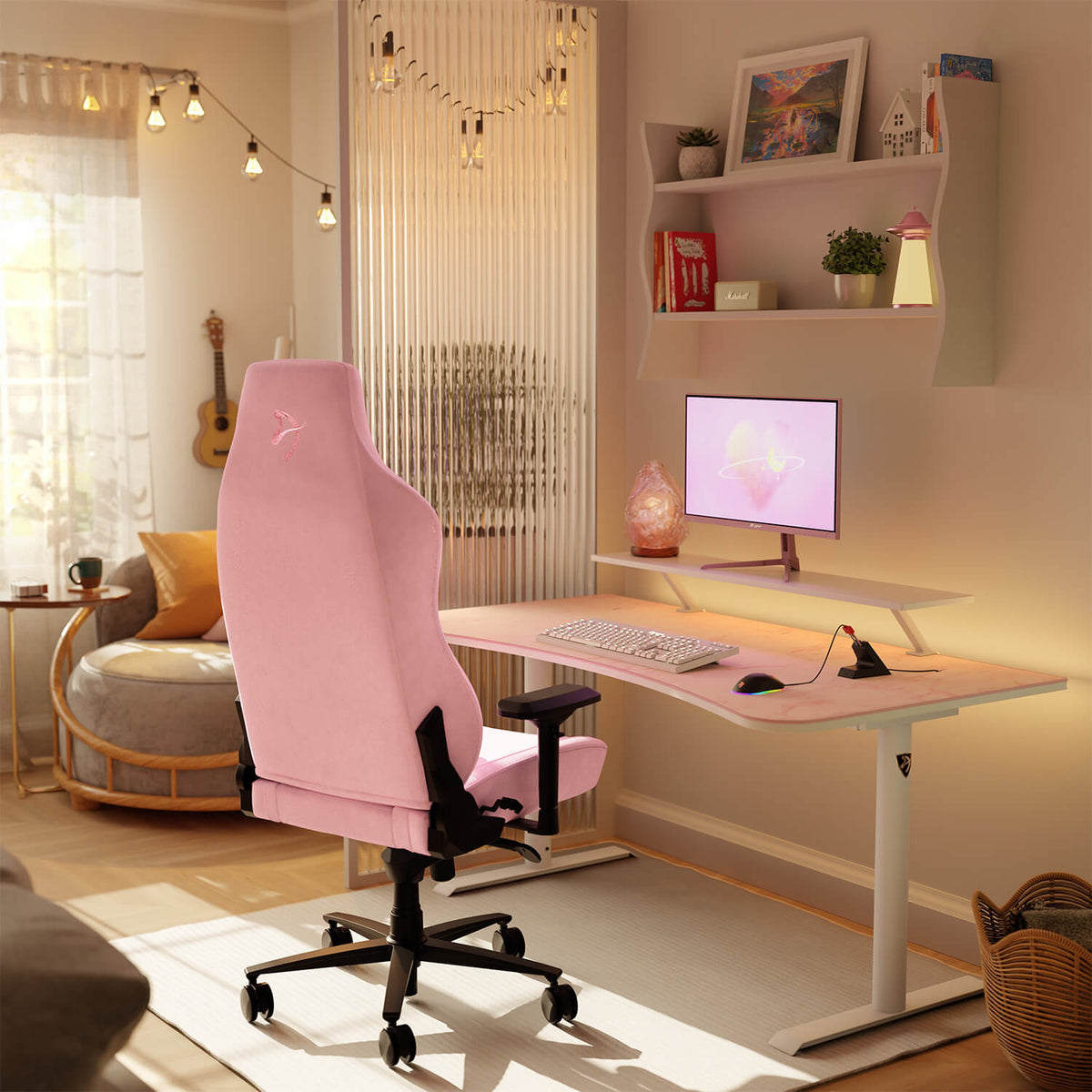 A cozy home office with a pink gaming chair, wall shelves, and an Arozzi Europe Arena Mousepad.
