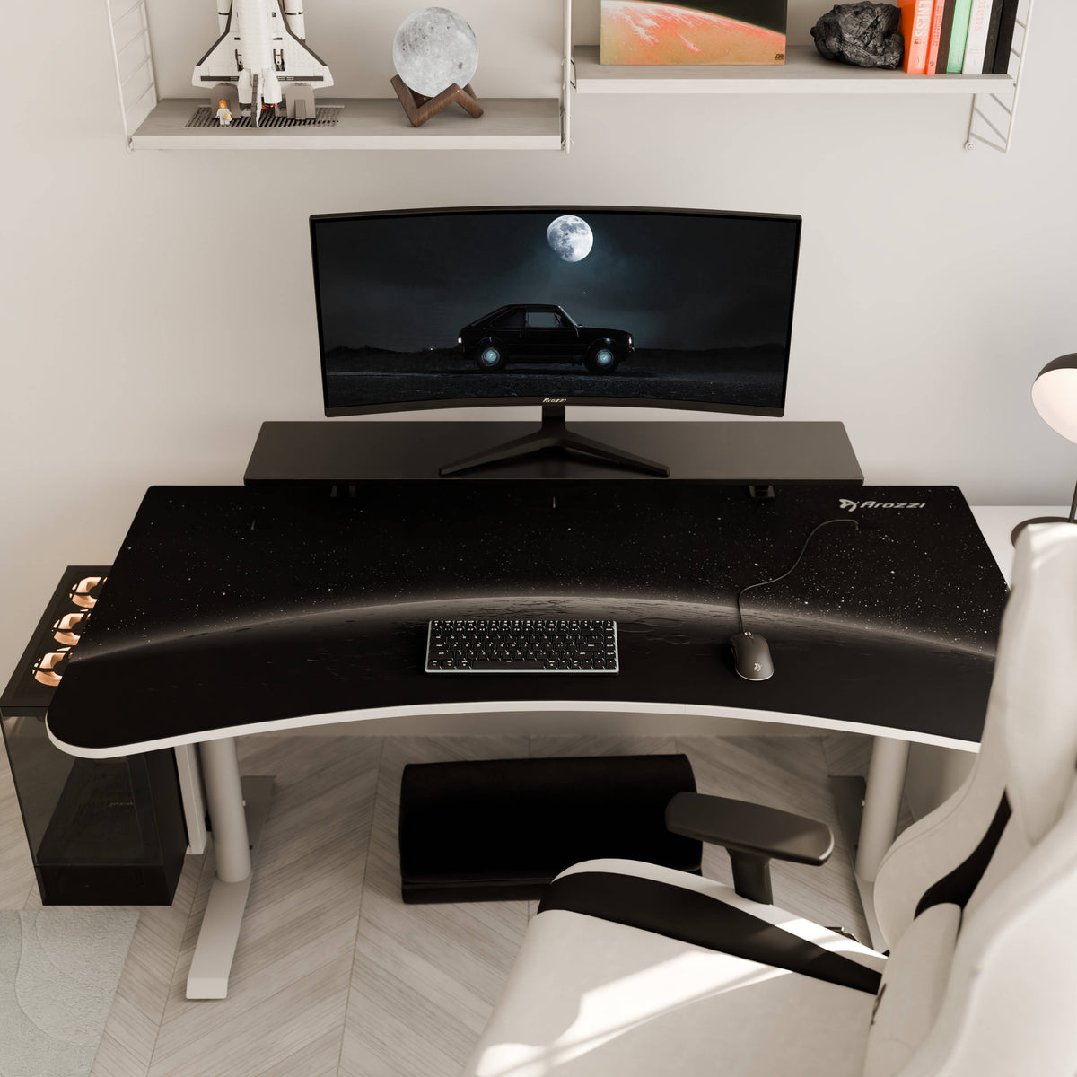 Curved monitor on desk with keyboard, Arozzi Europe Arena Mousepad, and modern white chair.