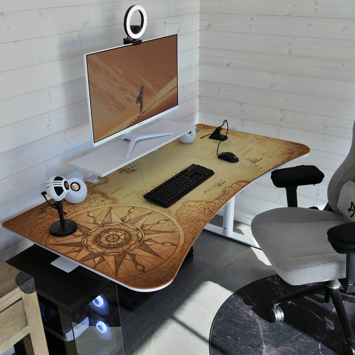 Curved desk, map design, monitor, gray chair, speakers & Arena Mousepad by Arozzi Europe setup.