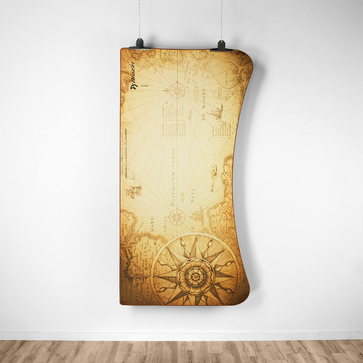 Curved wall art like an old map decorates a gallery above an Arozzi Europe Arena Mousepad.