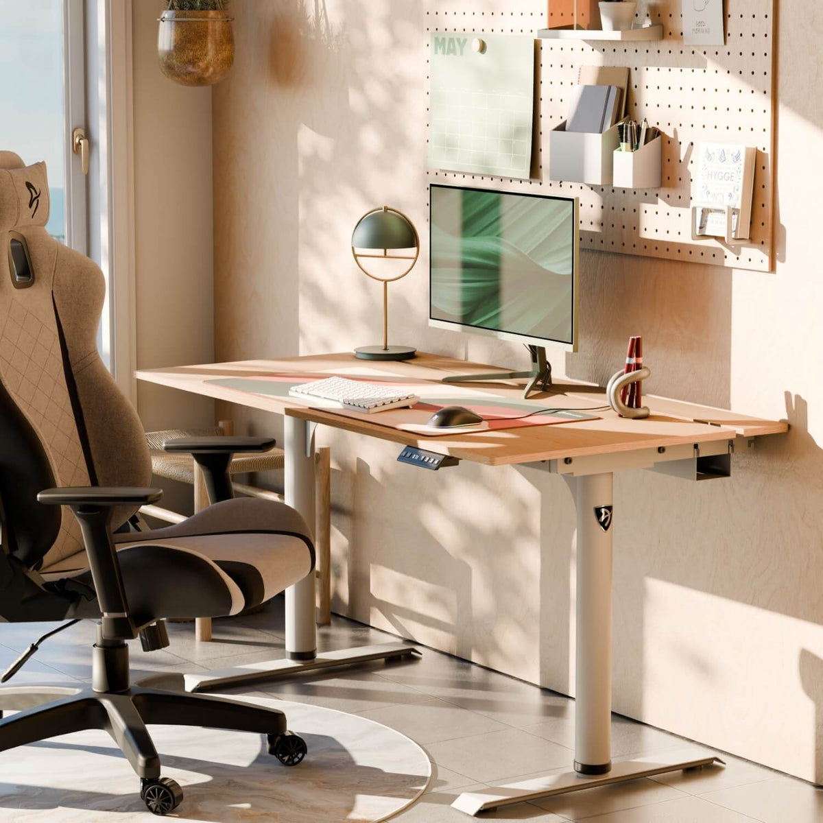Arena Nordico electric standing desk setup by Arozzi Europe with monitor, chair, lamp, pegboard.