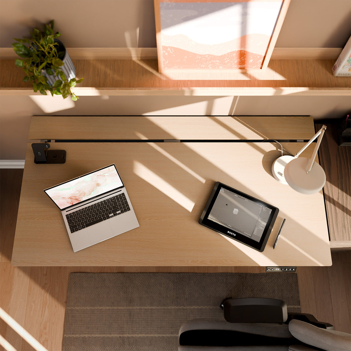 Arena Nordico desk by Arozzi Europe with laptop, drawing tablet, lamp, plant, and framed art.