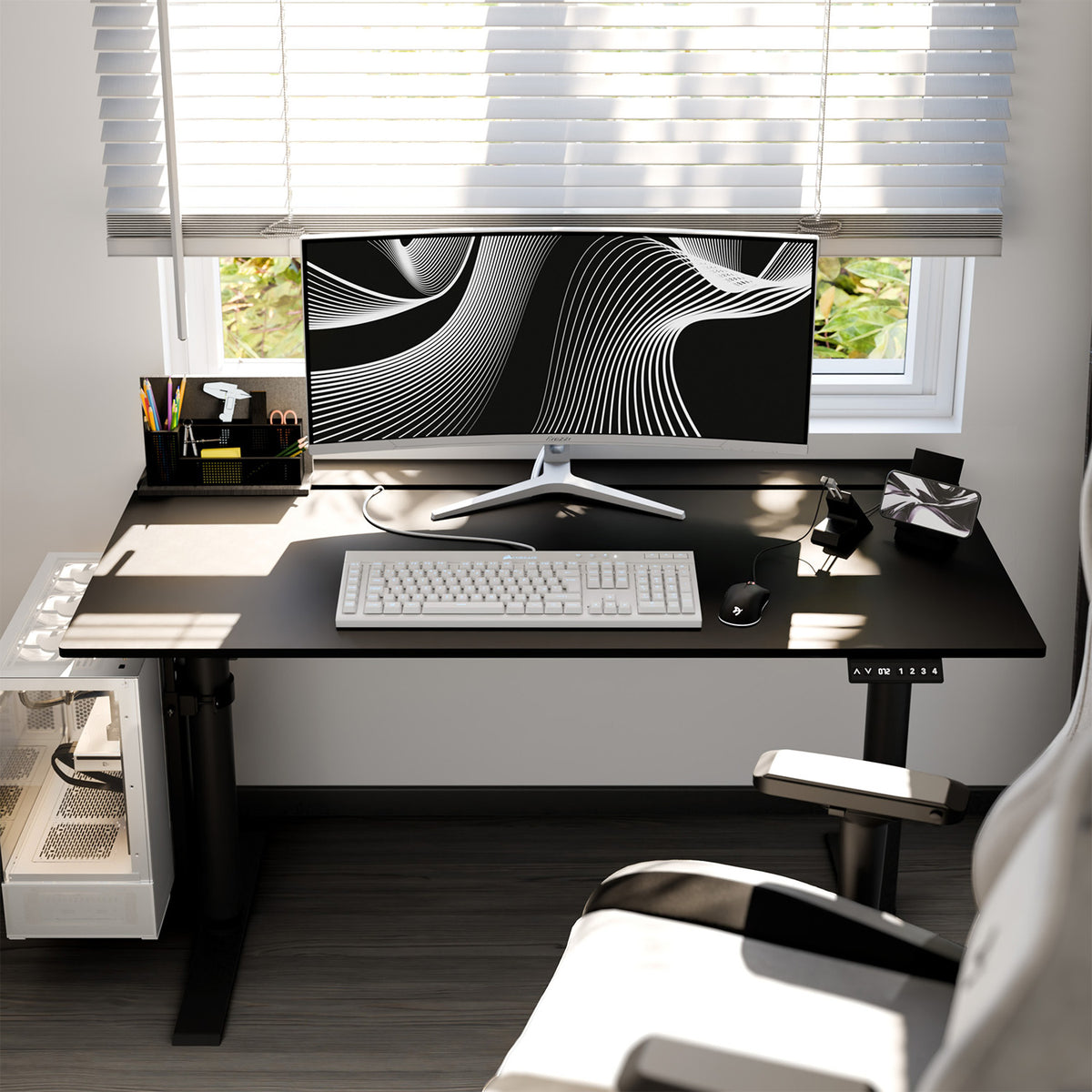 Arozzi Arena Nordico electric standing desk with monitor and office supplies by a window.