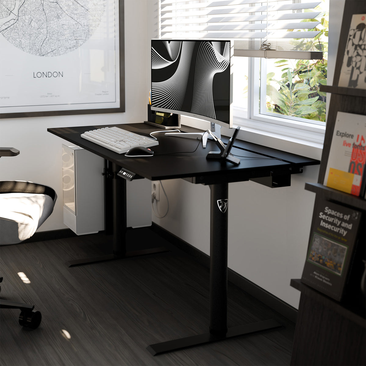 Arozzi Arena Nordico electric standing desk with computer, keyboard, and decor by window.