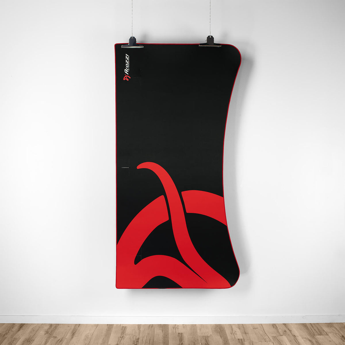 Arozzi Europe Arena Mousepad: black and red, bold display above wood floor like climbing wall.