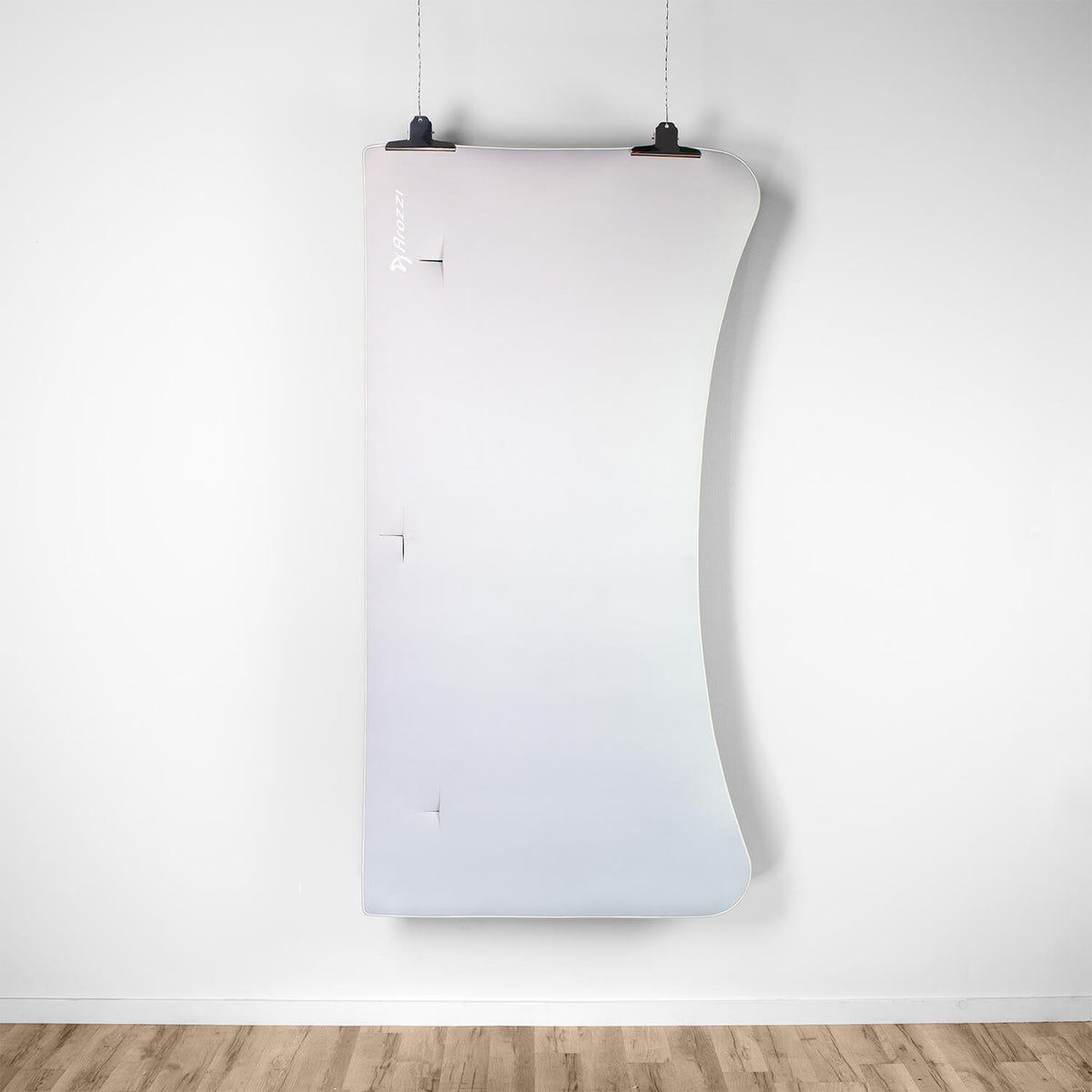 Arena Mousepad by Arozzi Europe sits below a unique wall mirror on white wall and wood floor.