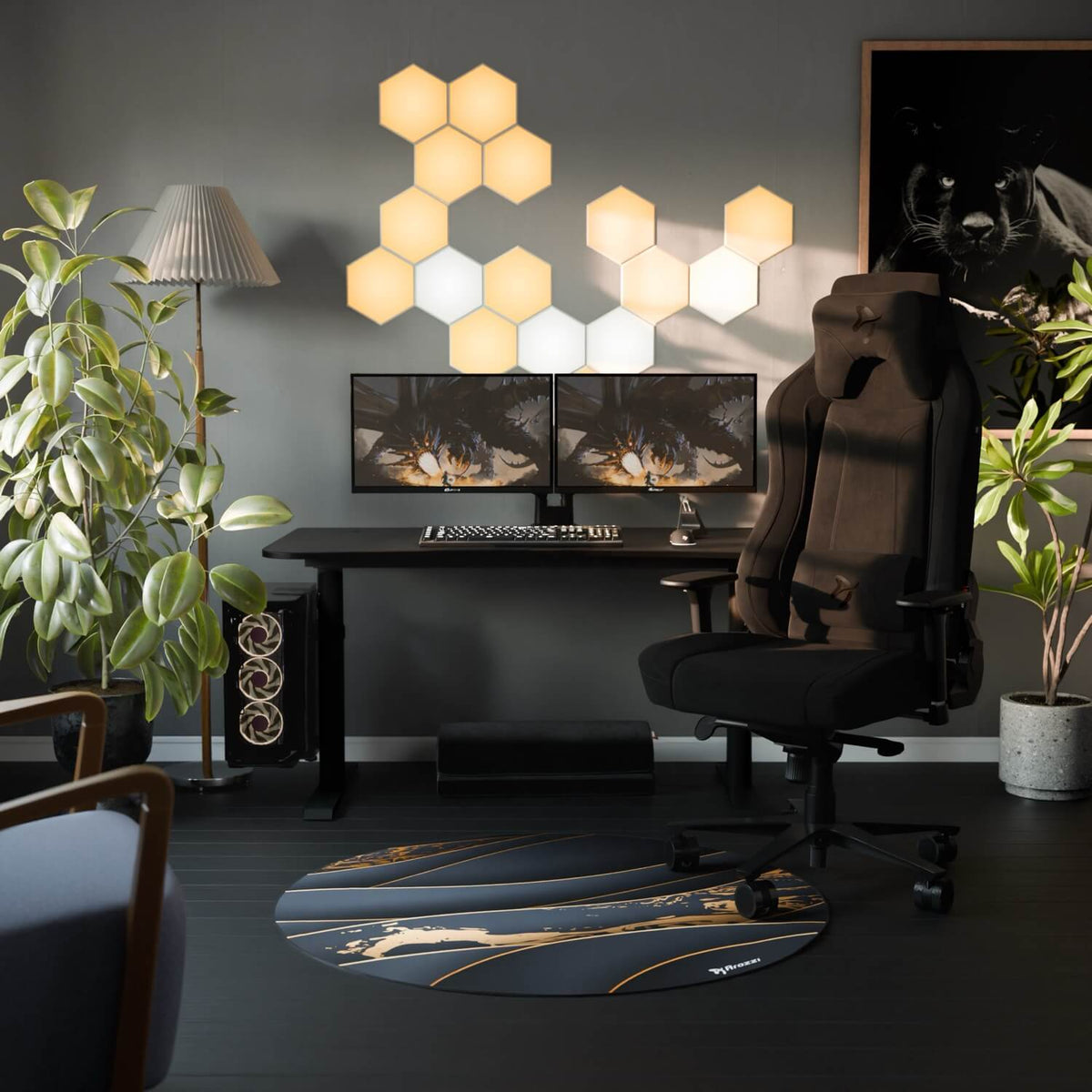Dual monitors on Arozzi Arena desk, hex lights, plants, and a black chair create a sleek setup.