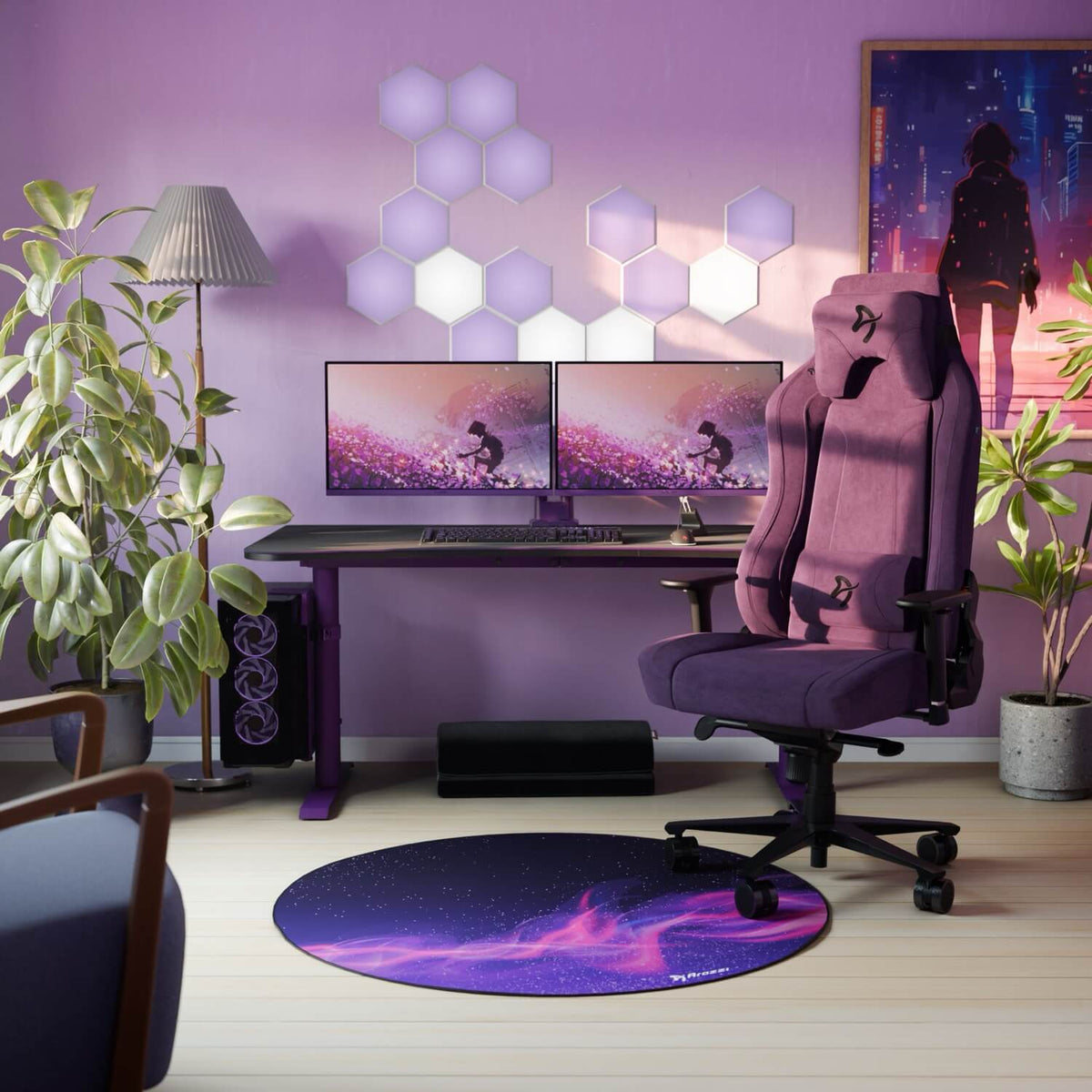 Purple gaming setup with dual monitors, Arena Gaming Desk by Arozzi, plants, and tidy cables.