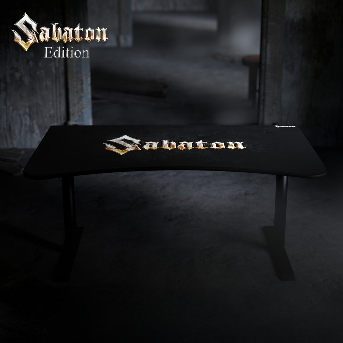 Black Arena Gaming Desk Sabaton Edition by Arozzi Europe in a dimly lit, industrial room.