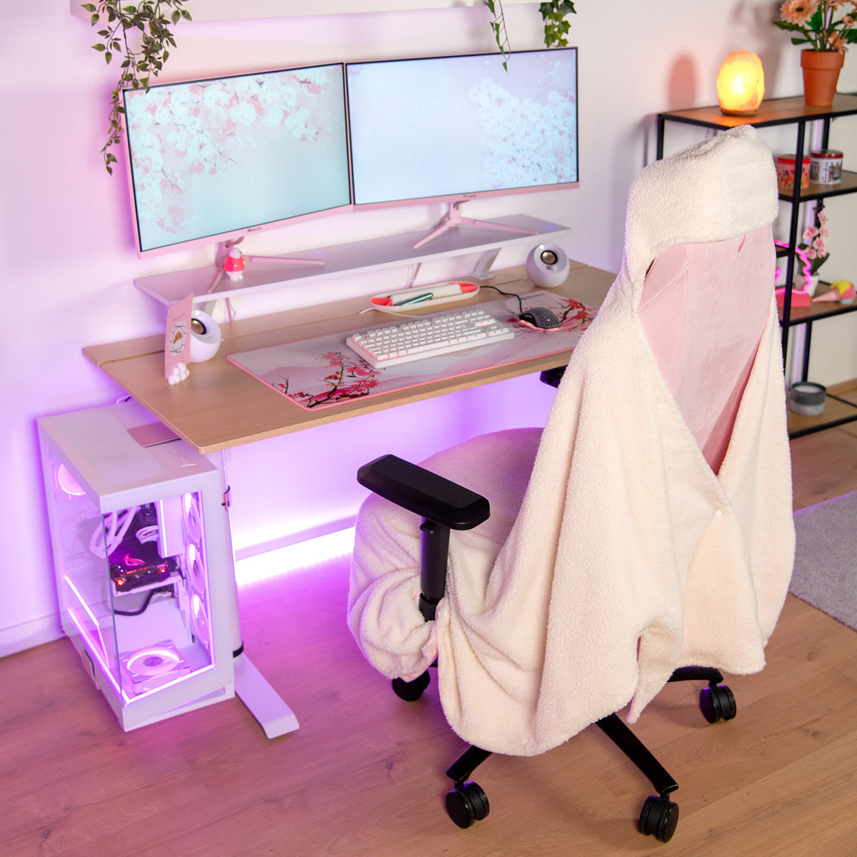 Dual-monitor desk setup with an Arozzi Europe Chair Blanket, purple lights for cozy gaming vibes.