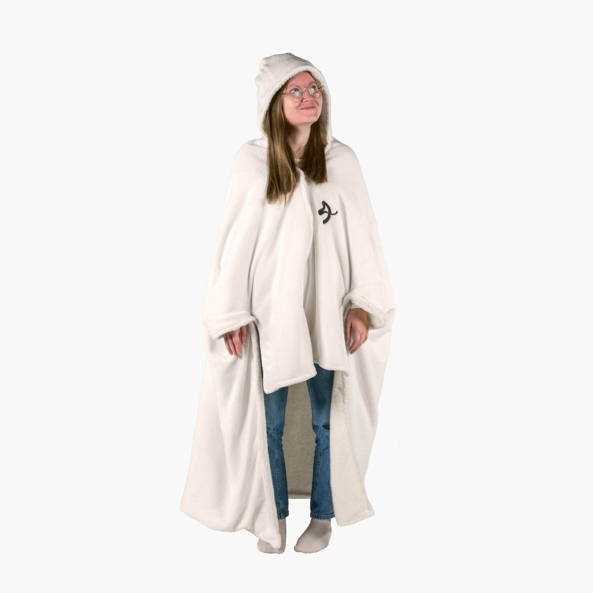 Smiling person in Arozzi Europe Chair Blanket, glasses, jeans, and socks, standing comfortably.