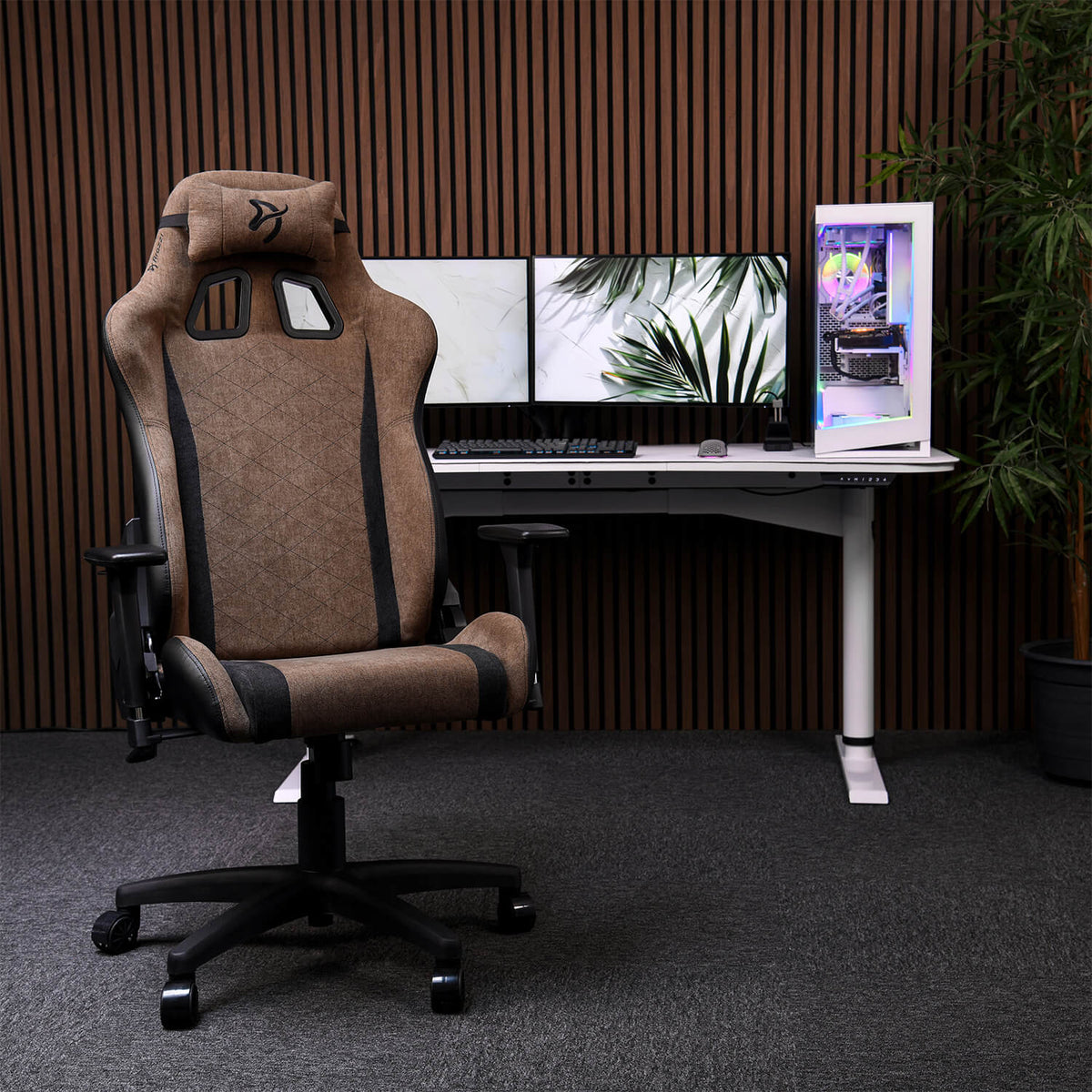 Avanti Soft Fabric by Arozzi Europe with head pillow in front of dual monitors and white PC.