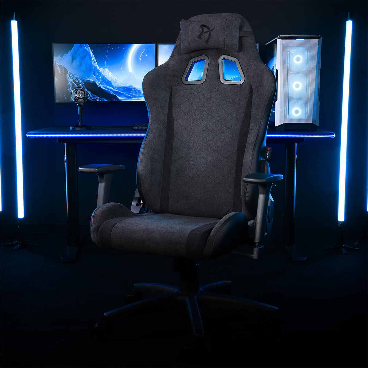Arozzi Europe Avanti Soft Fabric chair before twin monitors with blue LED lights.