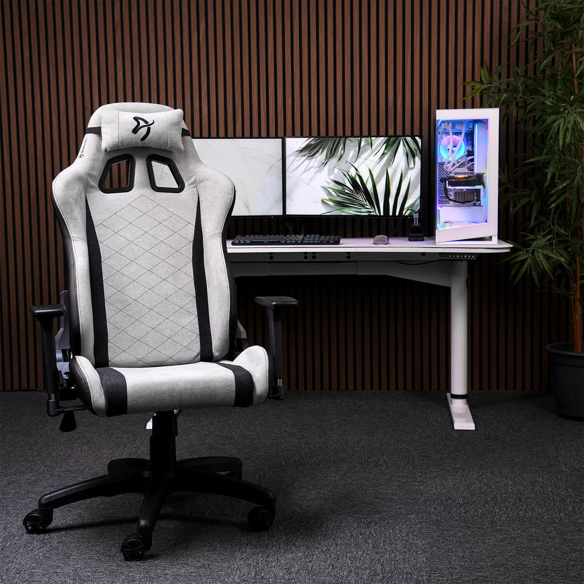 Arozzi Europe Avanti Soft Fabric chair with head pillow is by desk, dual monitors, and a PC.