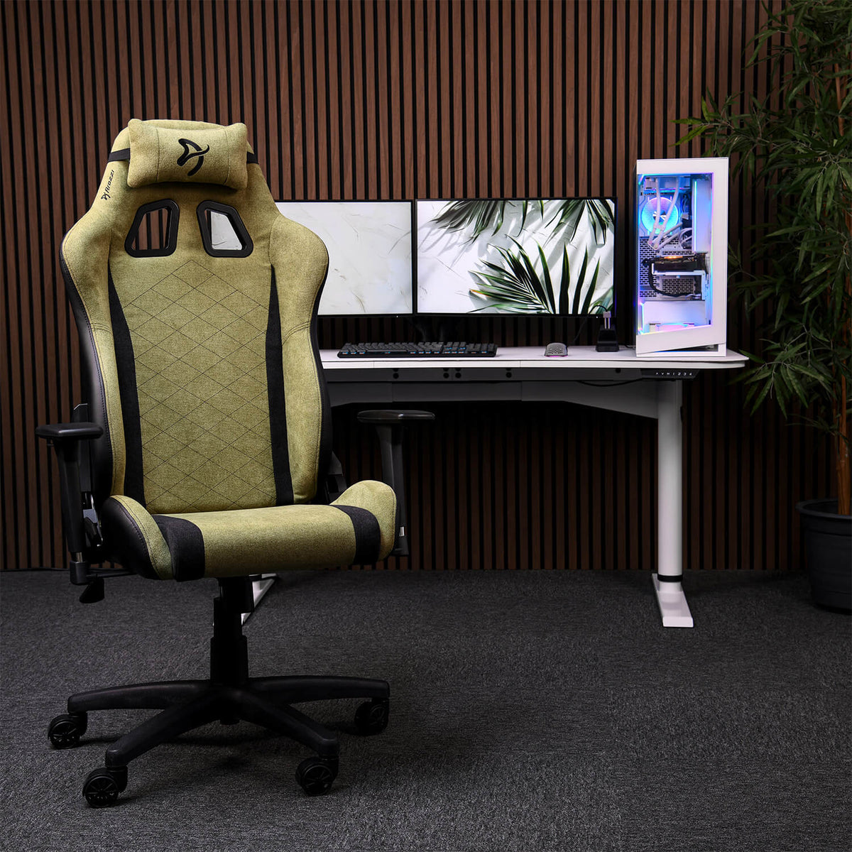 Arozzi Europe Avanti Soft Fabric chair with head pillow at desk, dual monitors, and lit PC.