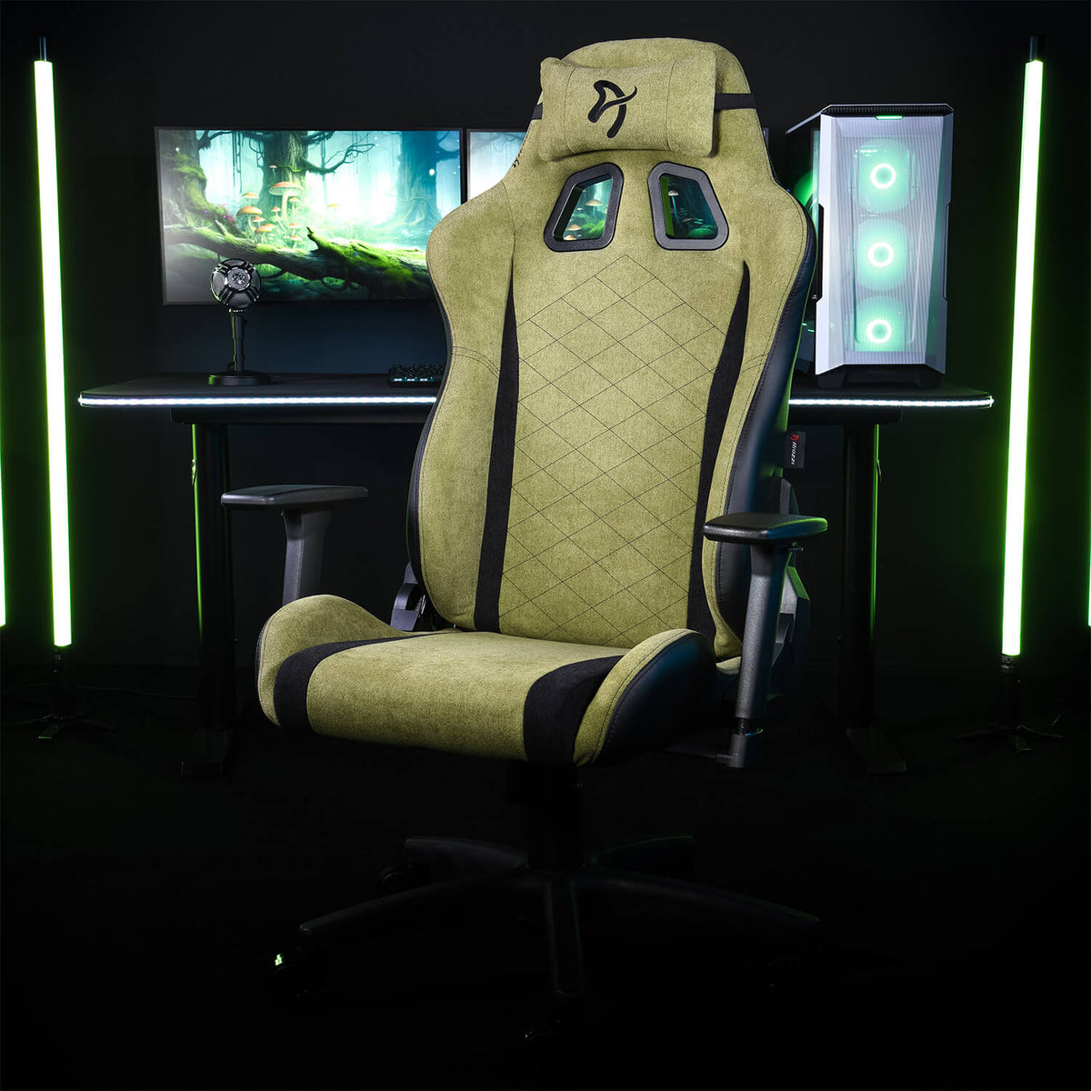 Arozzi Europe Avanti Soft Fabric chair with head pillow in front of dual monitors and glowing PC.