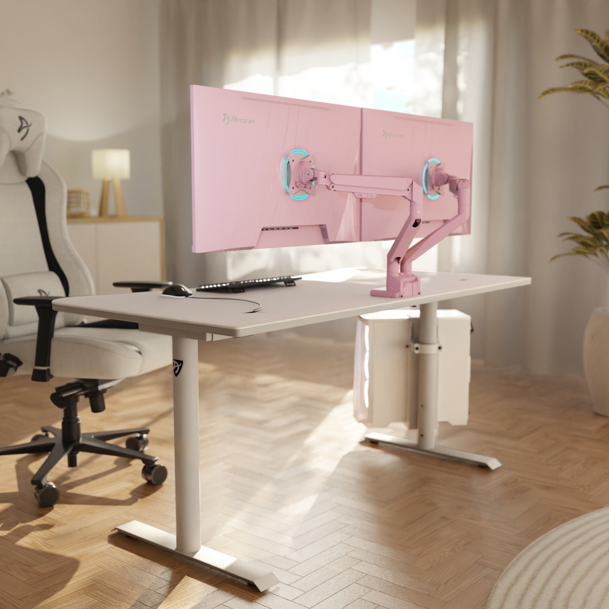 A white desk with Alzare Neo Duo arms by Arozzi Europe, dual monitors, white chair, soft light.