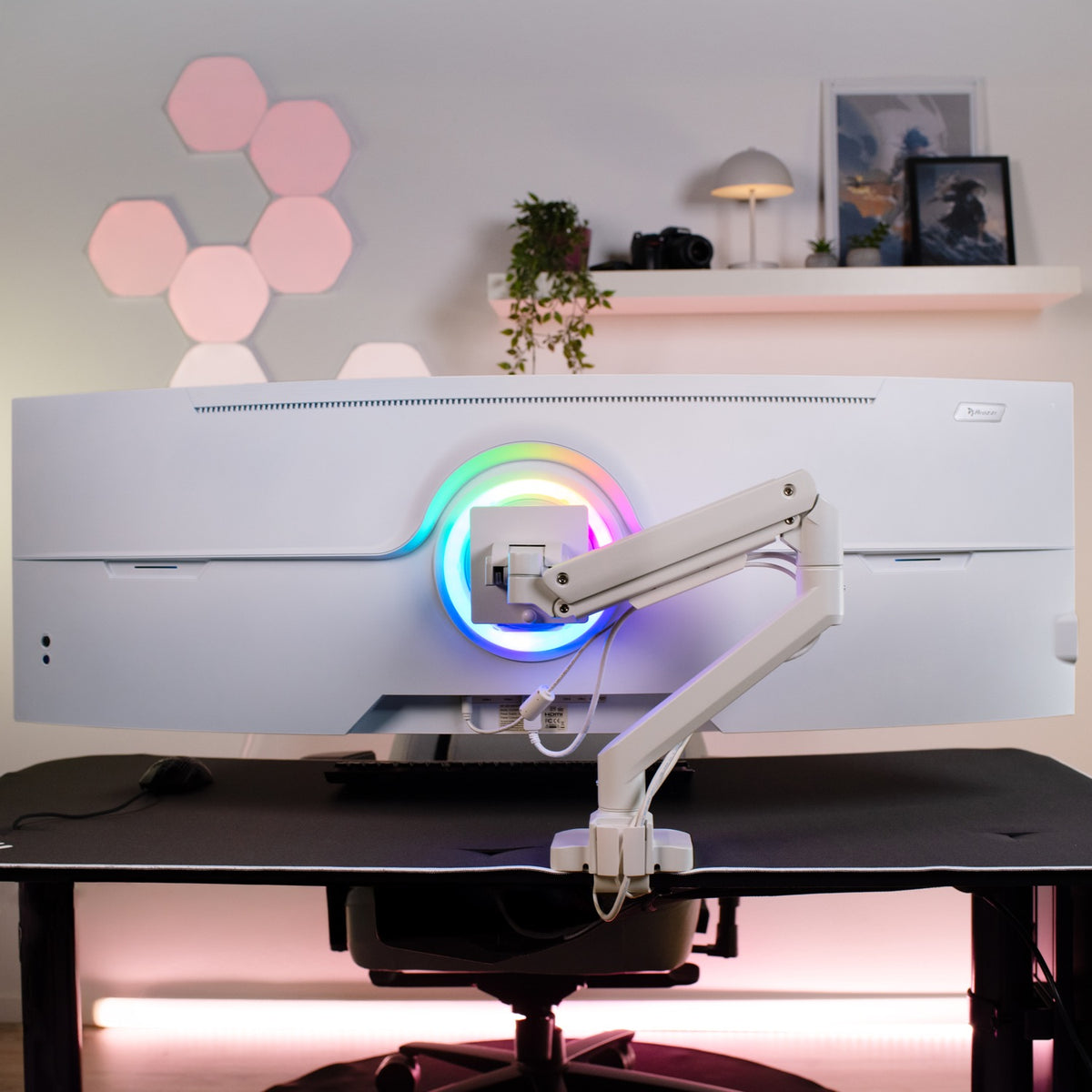 Curved white monitor on Alzare Neo Pro arm by Arozzi Europe, RGB lights visible from behind.