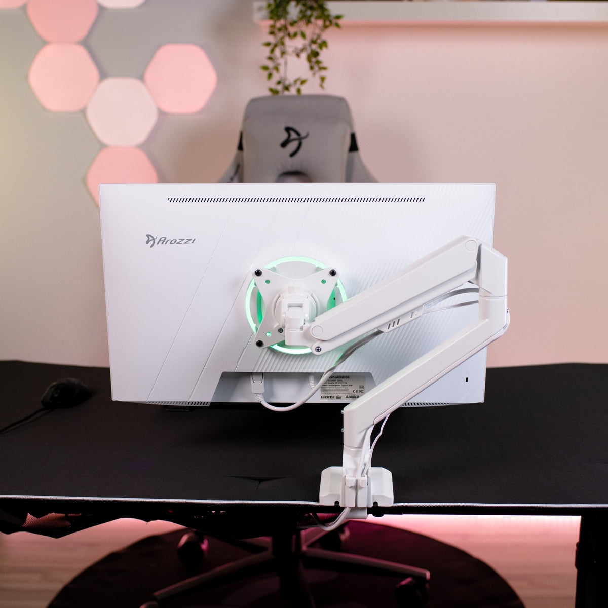 White Arozzi Alzare Neo Single monitor arm, glowing green ring, on matching desk setup.