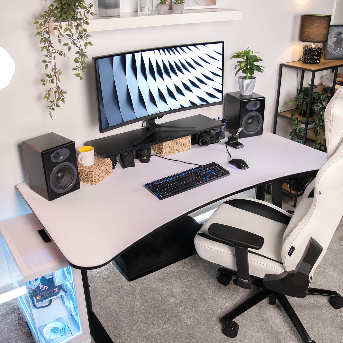 Modern setup: Arozzi Europe Desk Riser - Small, monitor stand, keyboard, speakers, plants, chair.