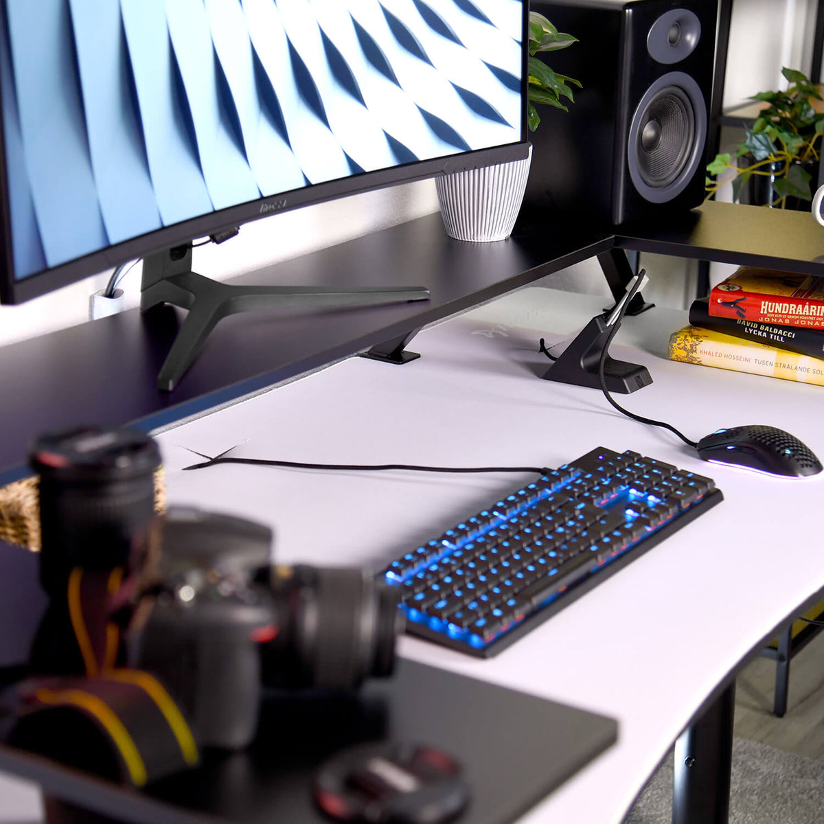 Arozzi Europe Desk Riser - Large holds a curved monitor, speakers, and keyboard in style.