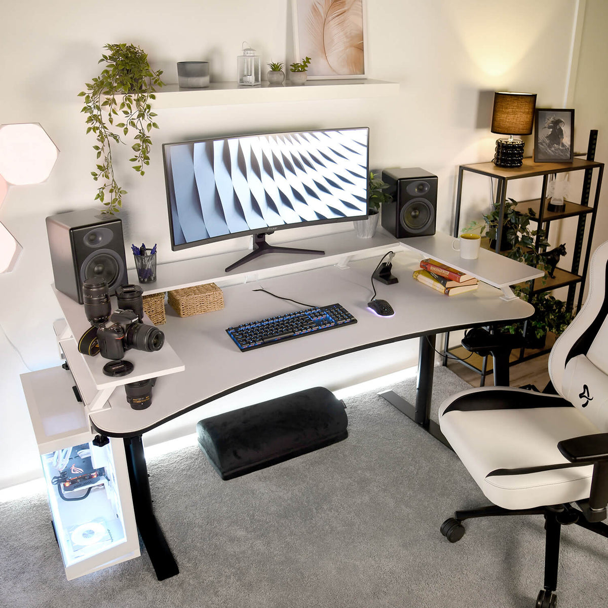 Desk setup with Arozzi Europe Desk Riser - Small, monitor, speakers, keyboard, and gaming chair.