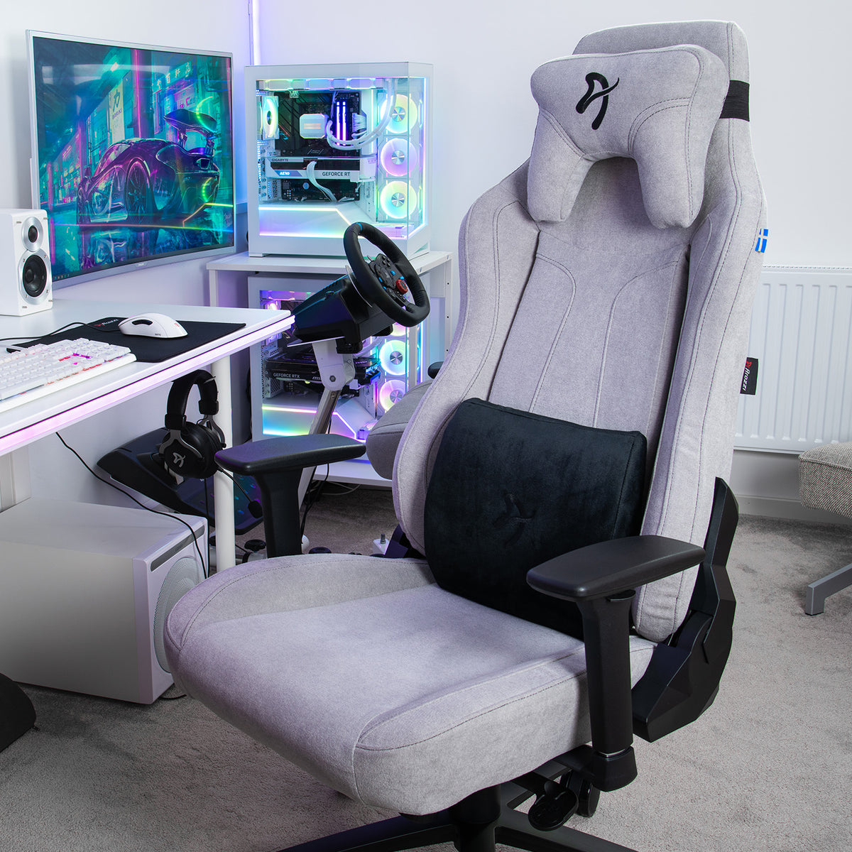 Arozzi Europe Lumbar Support Pillow Velvet Black on gaming chair by a desk, PC, and monitor.